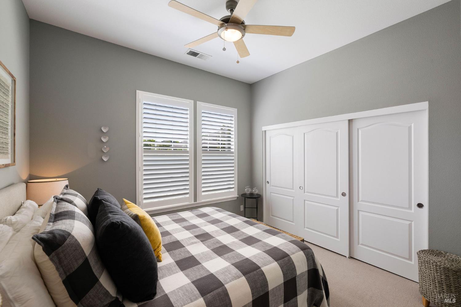 806 Chiles Avenue St. Helena, CA 94574 - Photo 21 of 38 a bedroom with a bed and a chandelier