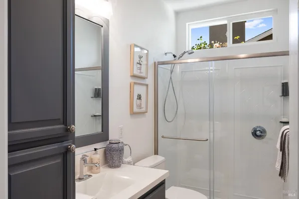 a room with a bed and a mirror