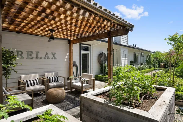 a dining room with furniture and wooden floor