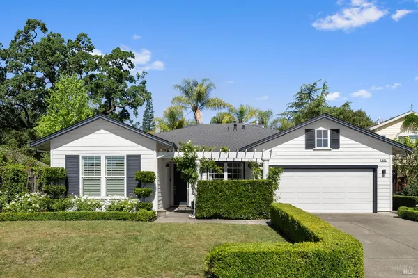a view of a chairs and table in the patio