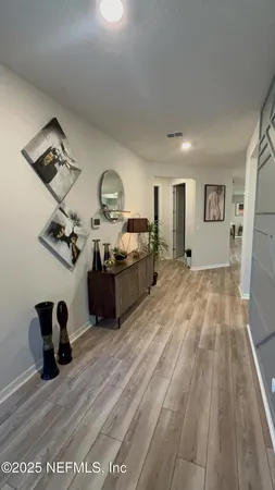 a view of a livingroom with wooden floor