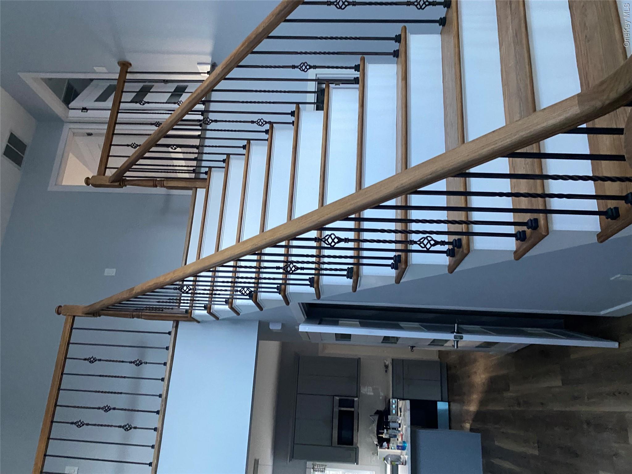 44 Roslyn Ridge Road Mongaup Valley, NY 12762 - Photo 3 of 24 Stairway featuring wood finished floors and a high ceiling