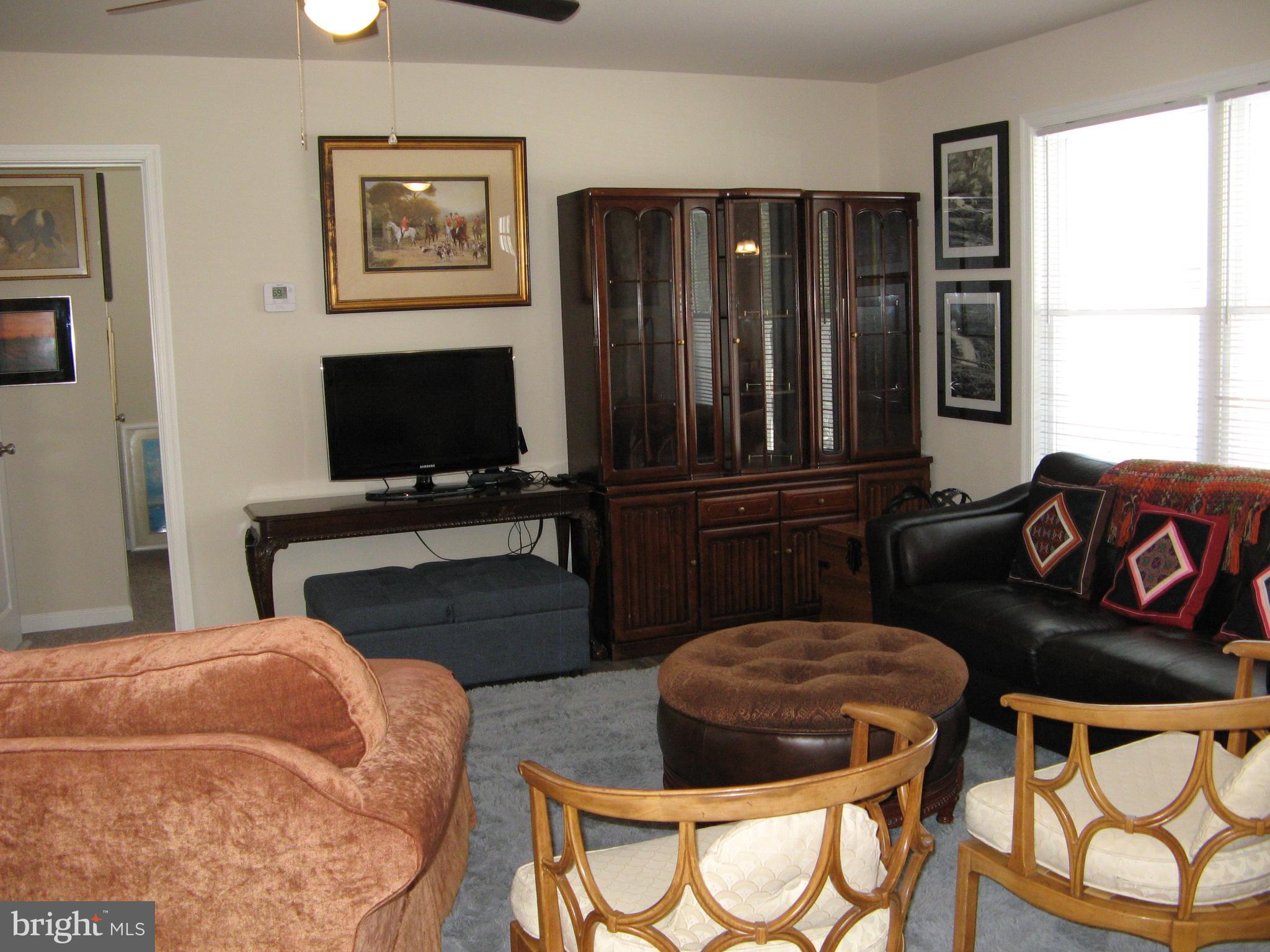 57 Oak Lane Colonial Beach, VA 22443 - Photo 11 of 47 a bedroom with two beds and a flat screen tv