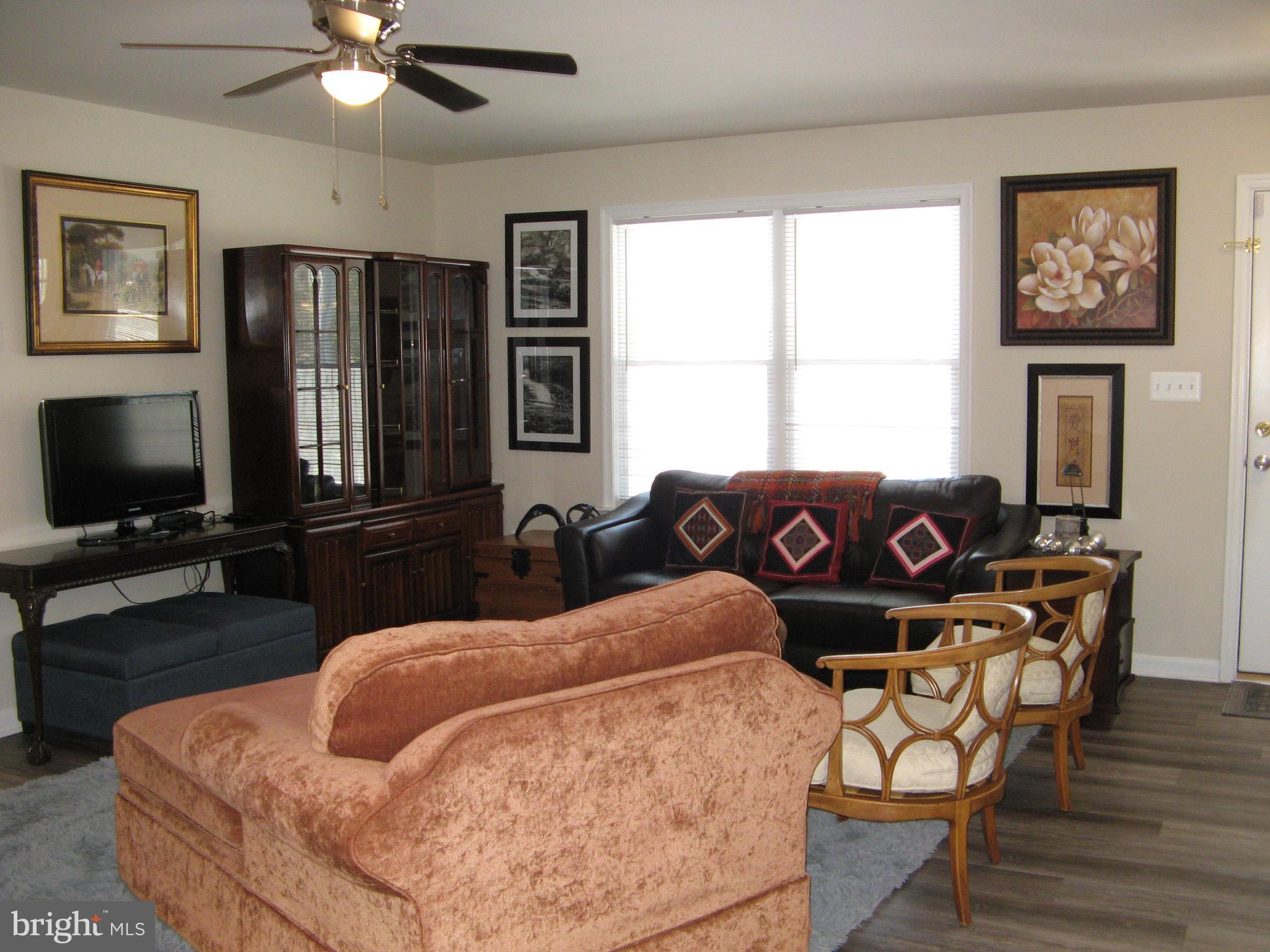 57 Oak Lane Colonial Beach, VA 22443 - Photo 12 of 47 a bedroom with furniture and a window
