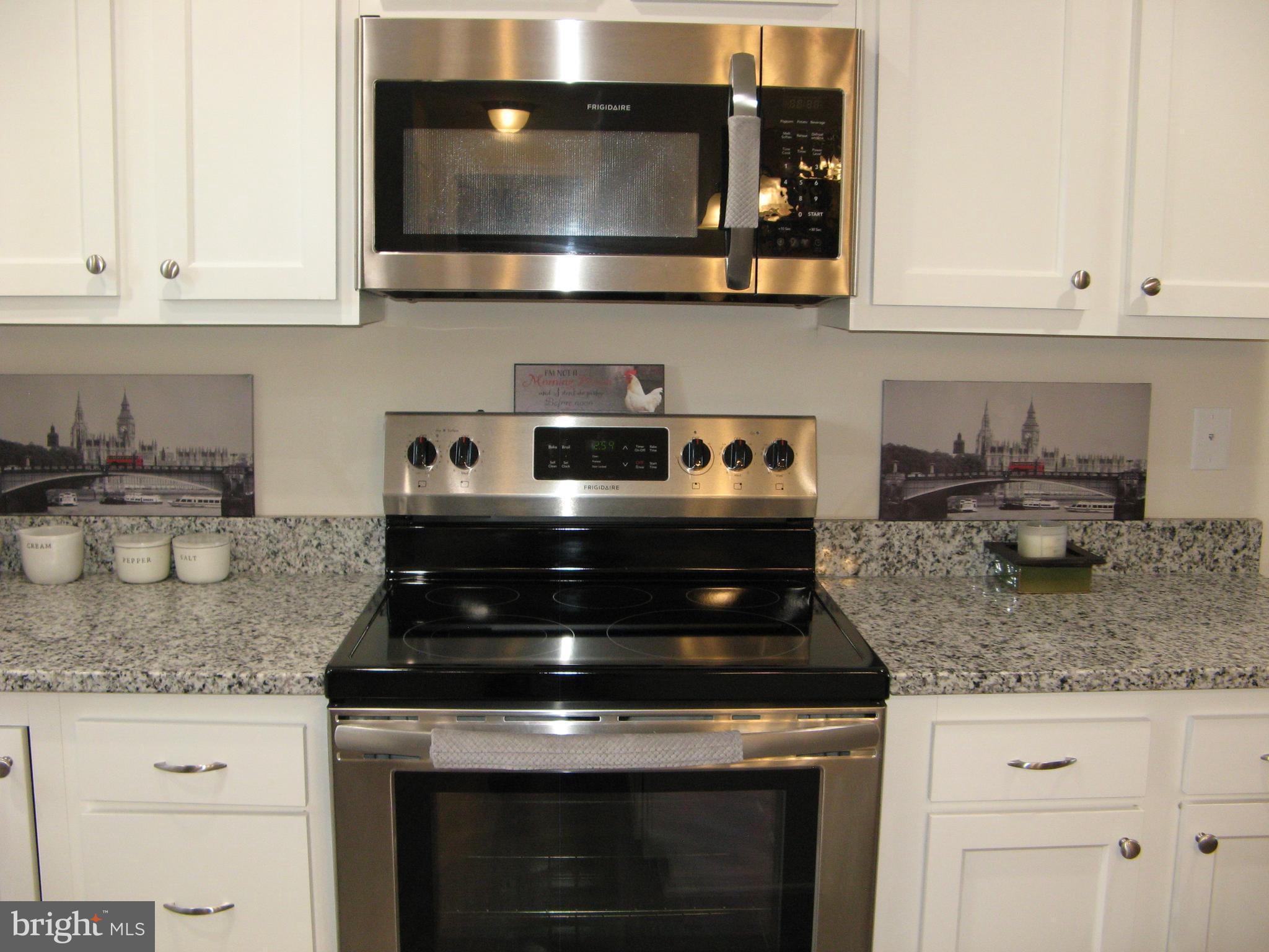 57 Oak Lane Colonial Beach, VA 22443 - Photo 18 of 47 a stove top oven sitting inside of a kitchen