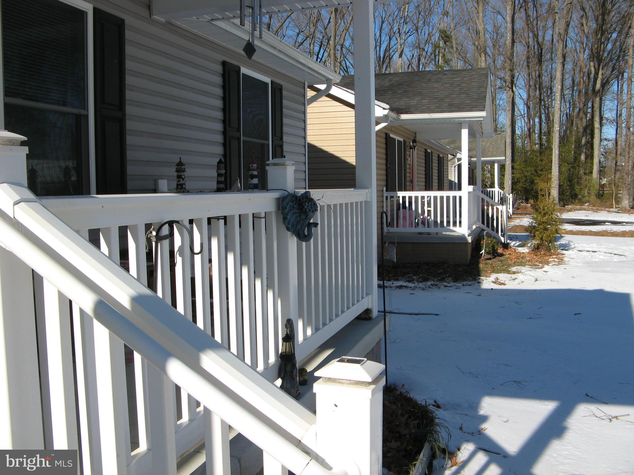 57 Oak Lane Colonial Beach, VA 22443 - Photo 2 of 47 a view of a balcony with two chairs