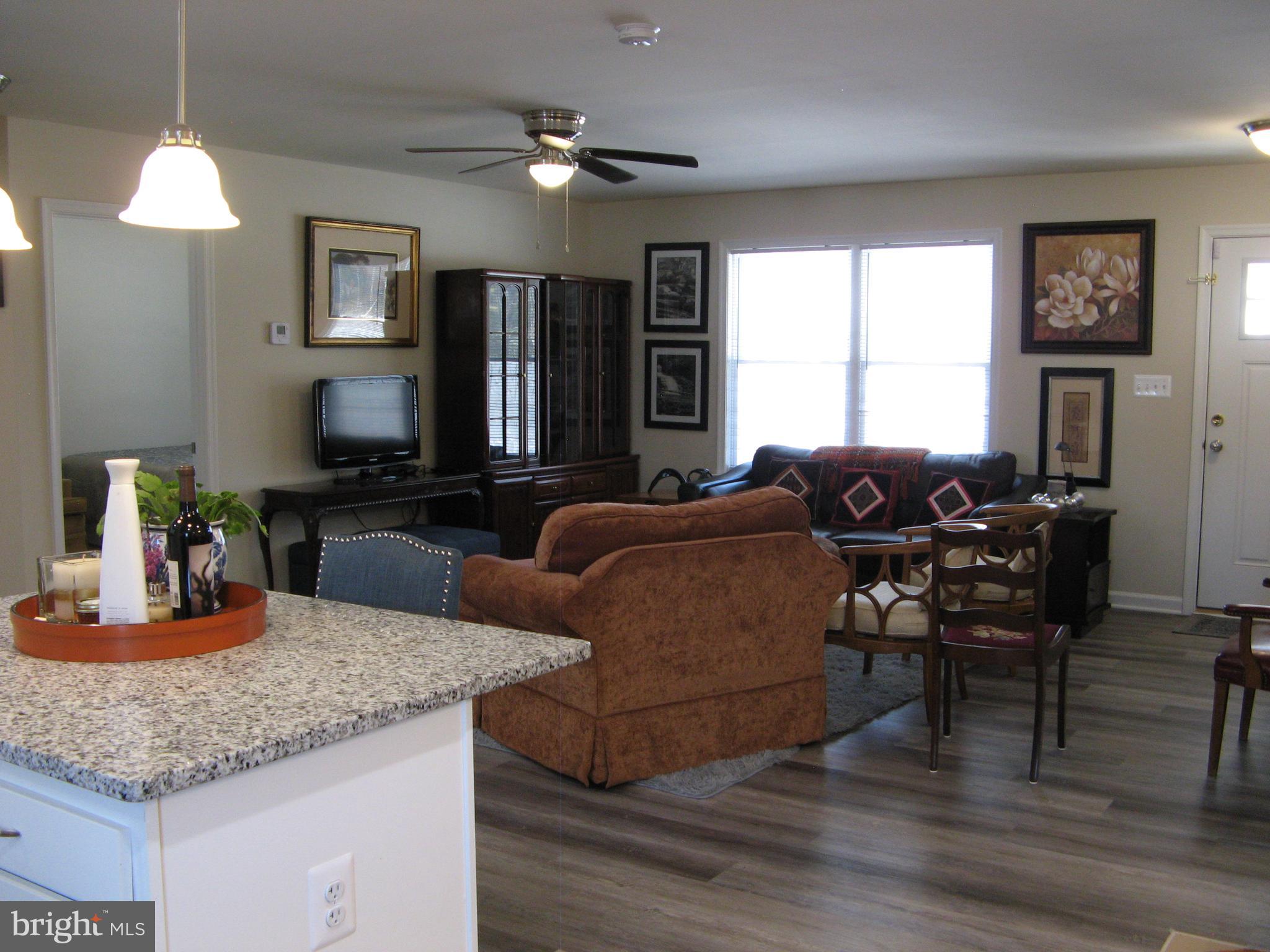57 Oak Lane Colonial Beach, VA 22443 - Photo 21 of 47 a living room with furniture and a fireplace
