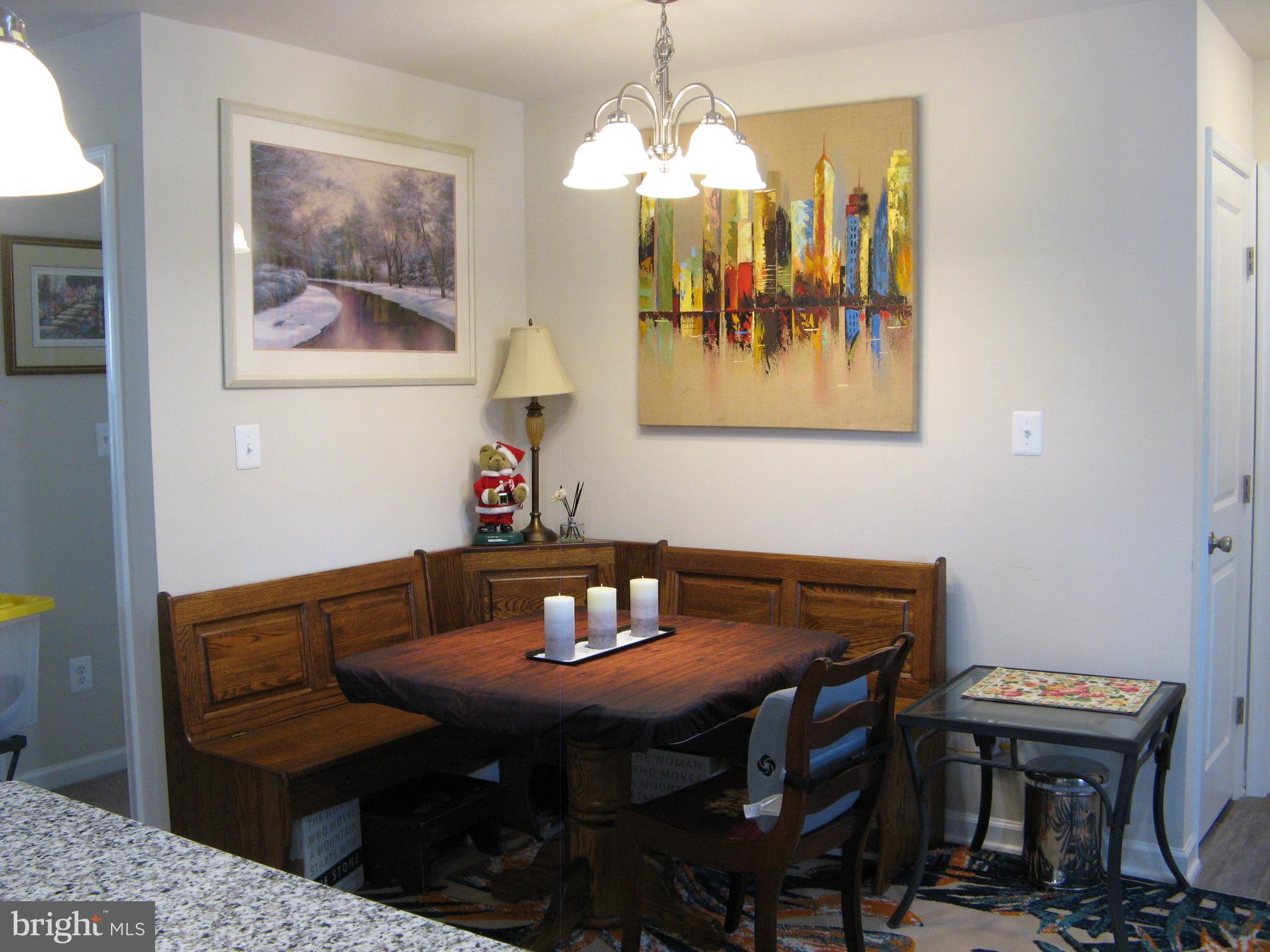 57 Oak Lane Colonial Beach, VA 22443 - Photo 22 of 47 a view of a dining room with furniture and wooden floor