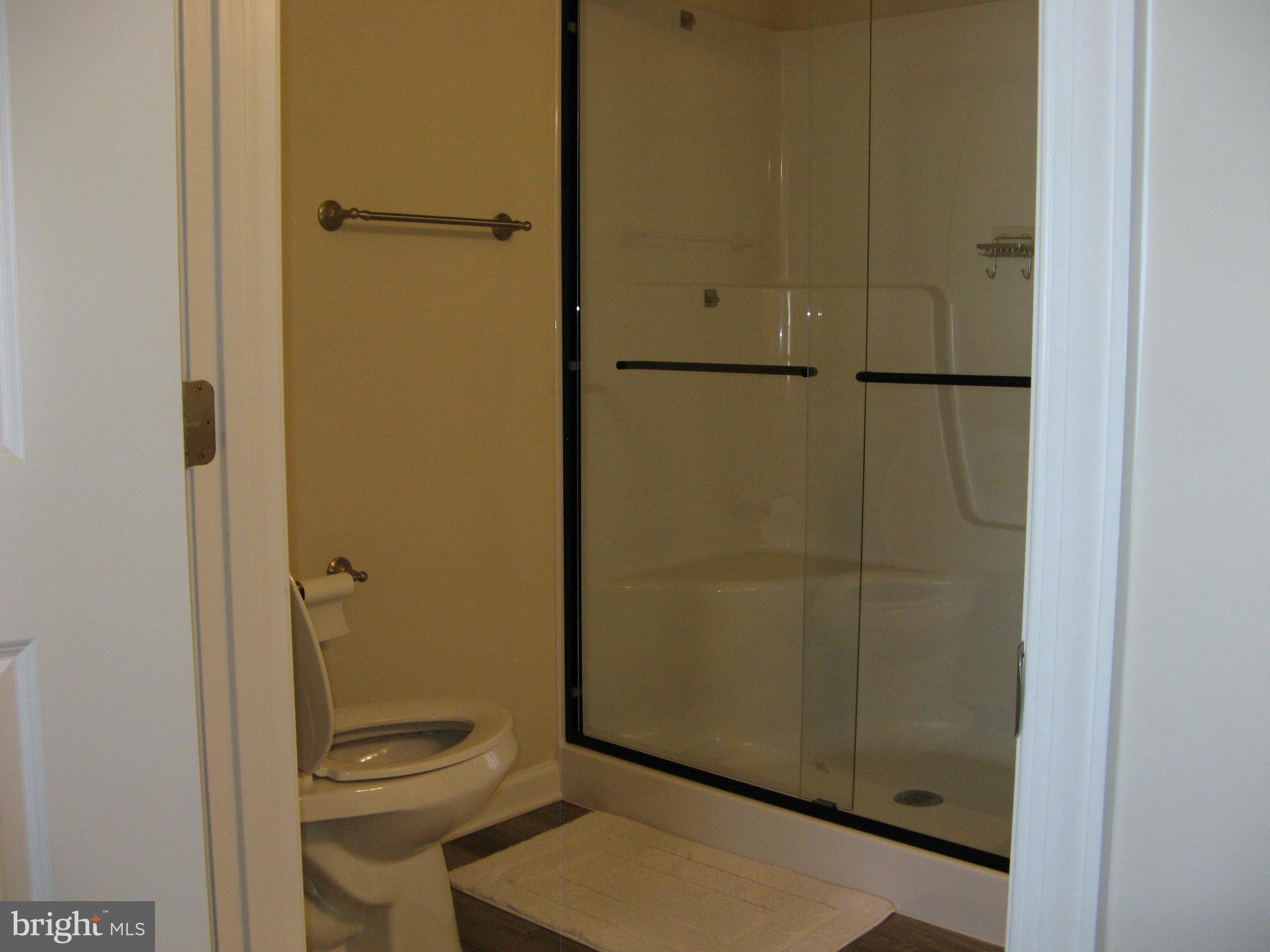 57 Oak Lane Colonial Beach, VA 22443 - Photo 28 of 47 a bathroom with a granite countertop toilet and a sink