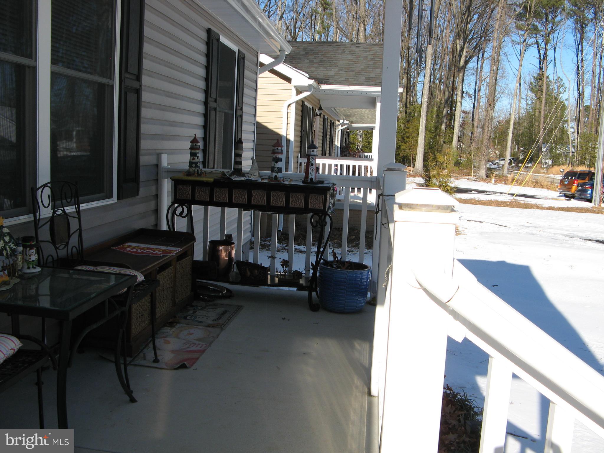57 Oak Lane Colonial Beach, VA 22443 - Photo 3 of 47 a view of a patio with a table and chairs