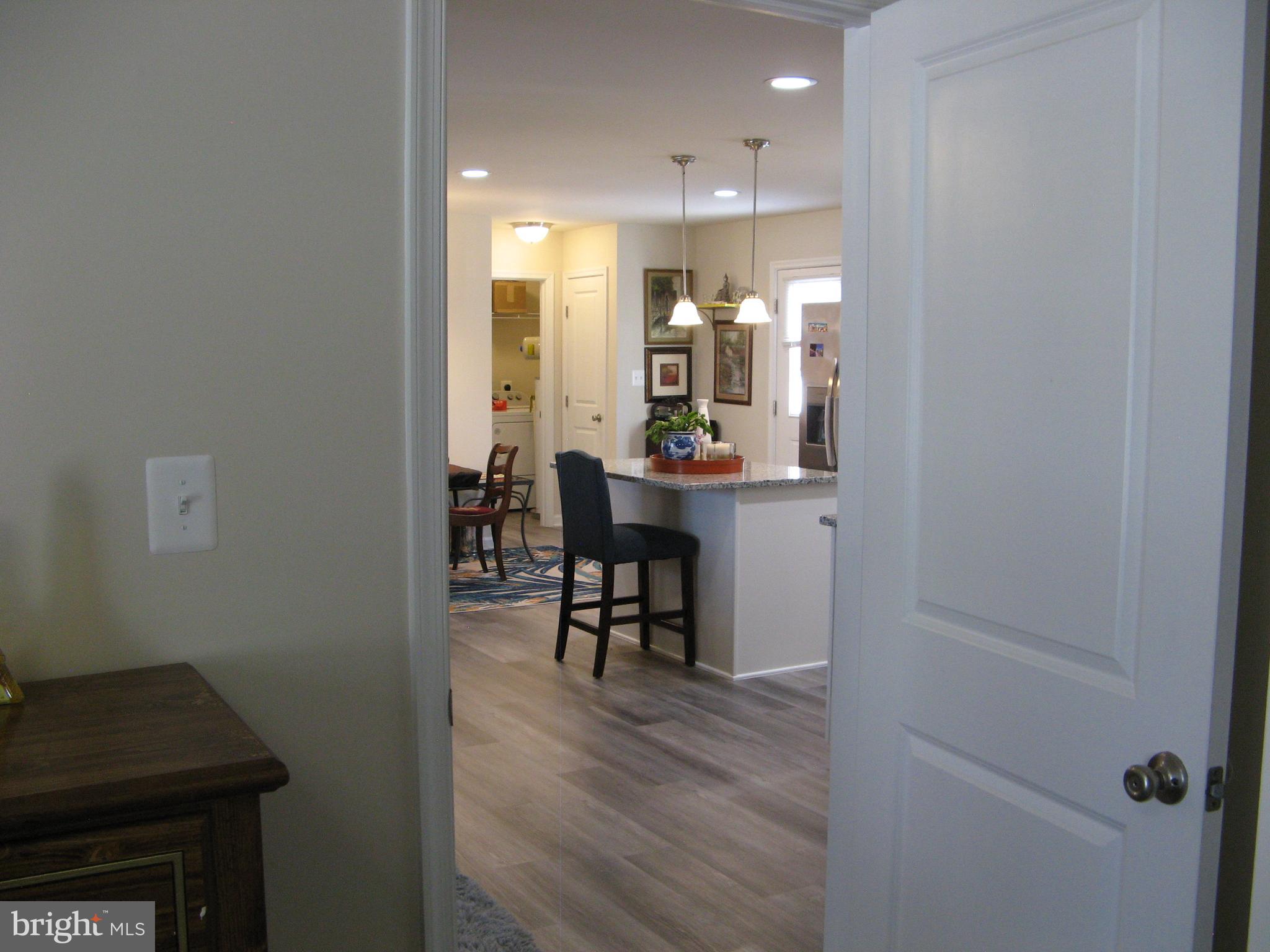 57 Oak Lane Colonial Beach, VA 22443 - Photo 31 of 47 a dining room with furniture and a chandelier