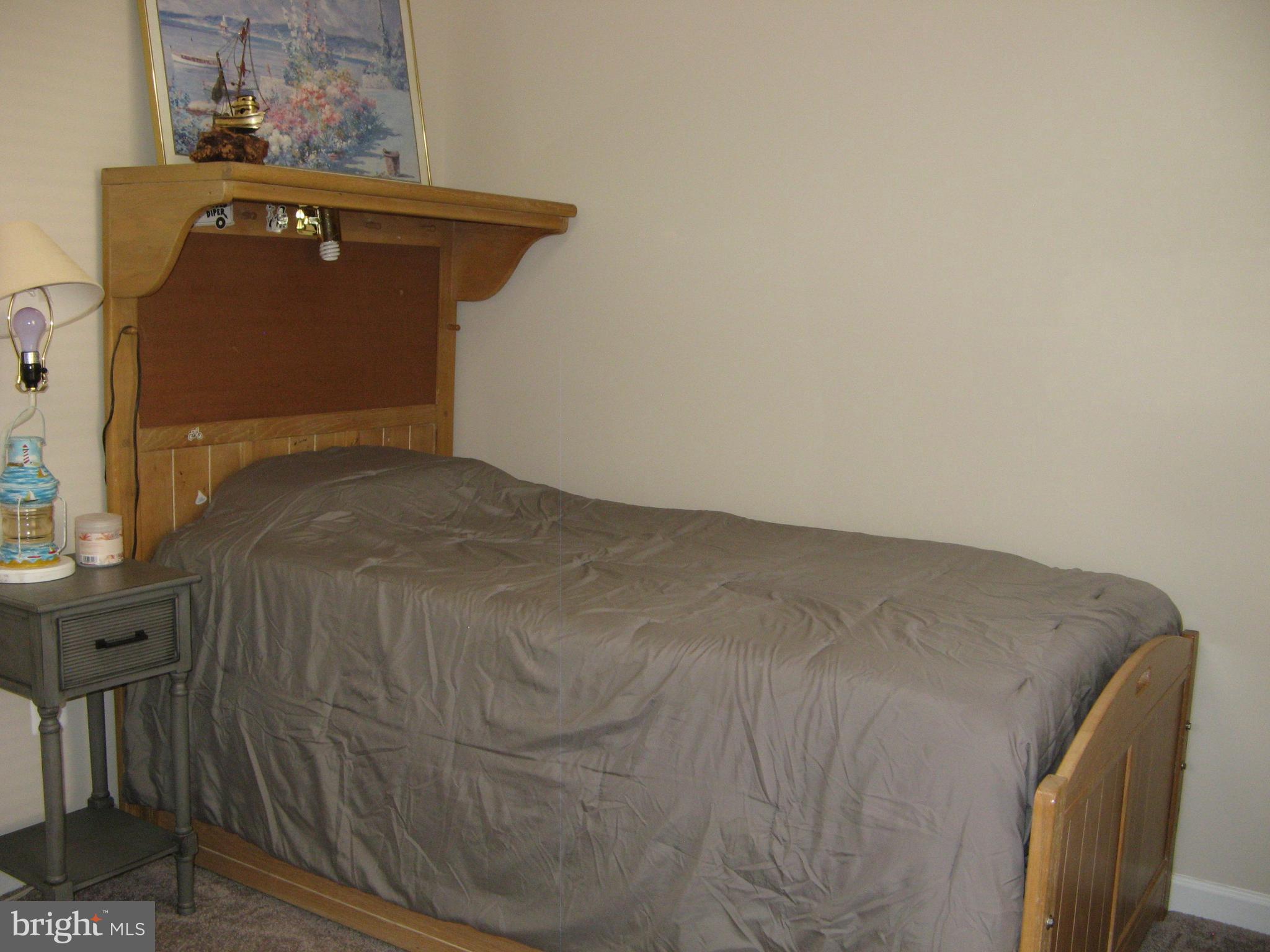 57 Oak Lane Colonial Beach, VA 22443 - Photo 32 of 47 a bedroom with a bed and wooden floor