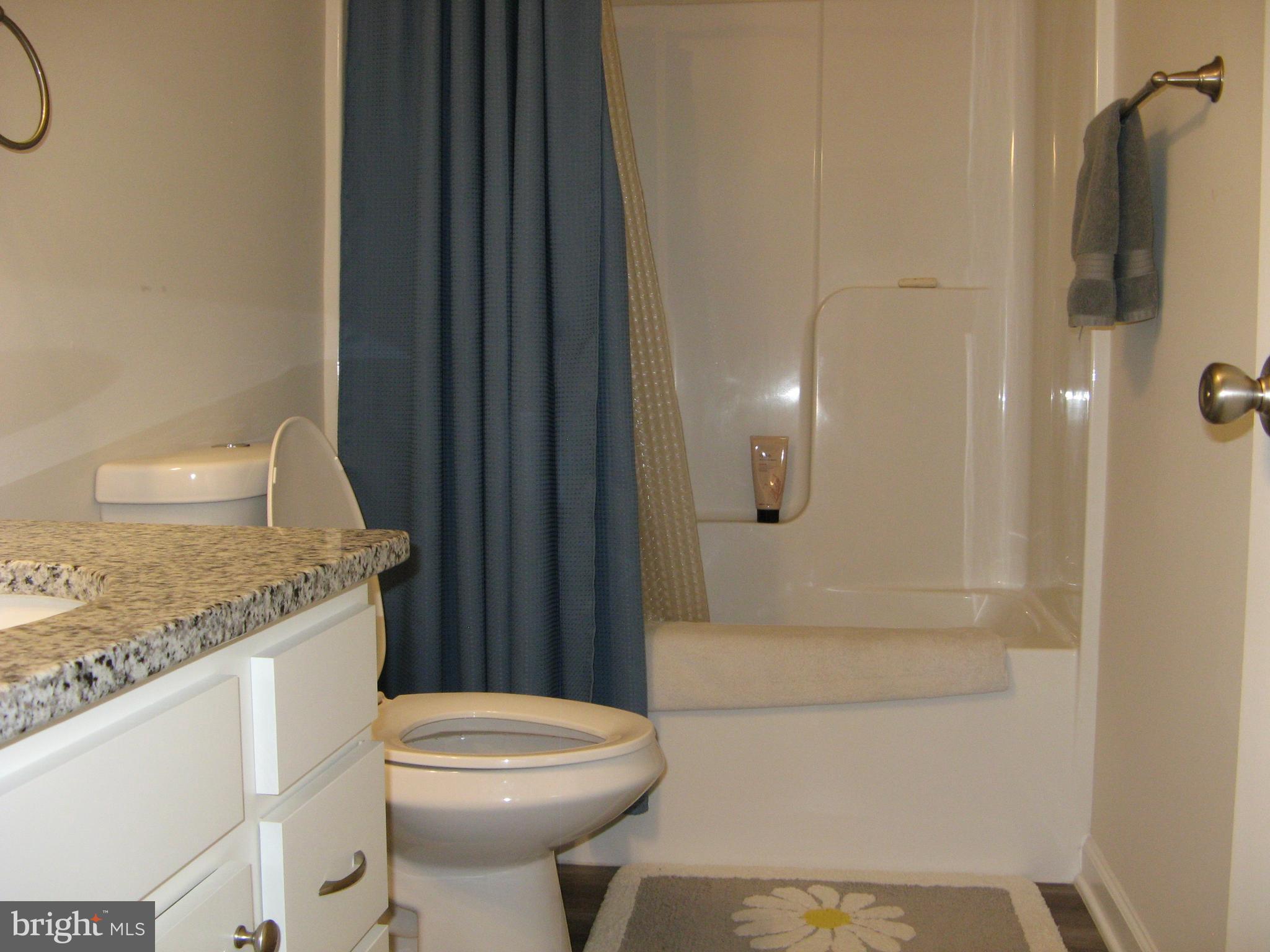 57 Oak Lane Colonial Beach, VA 22443 - Photo 33 of 47 a bathroom with a granite countertop sink toilet and shower