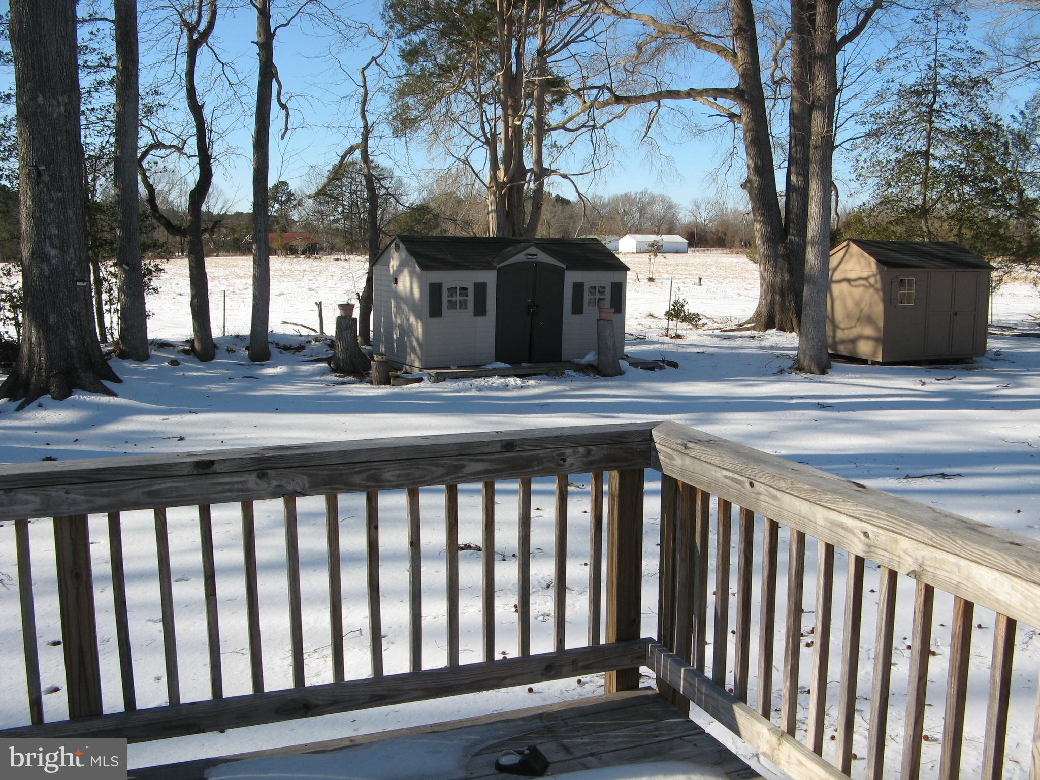 57 Oak Lane Colonial Beach, VA 22443 - Photo 35 of 47 a view of a brick house with large trees