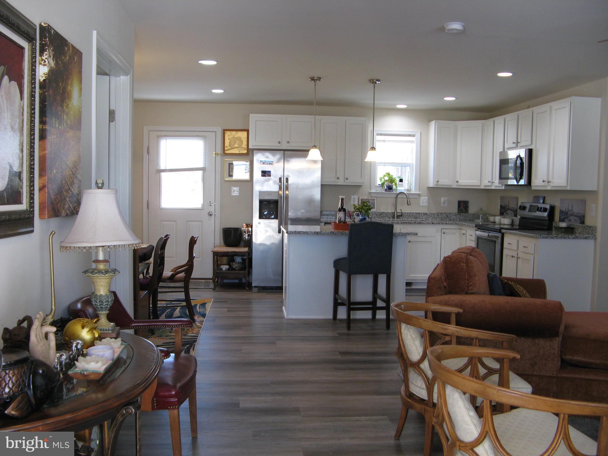 57 Oak Lane Colonial Beach, VA 22443 - Photo 9 of 47 a living room with lots of furniture and kitchen