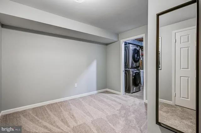 a view of a hallway with wooden shelves