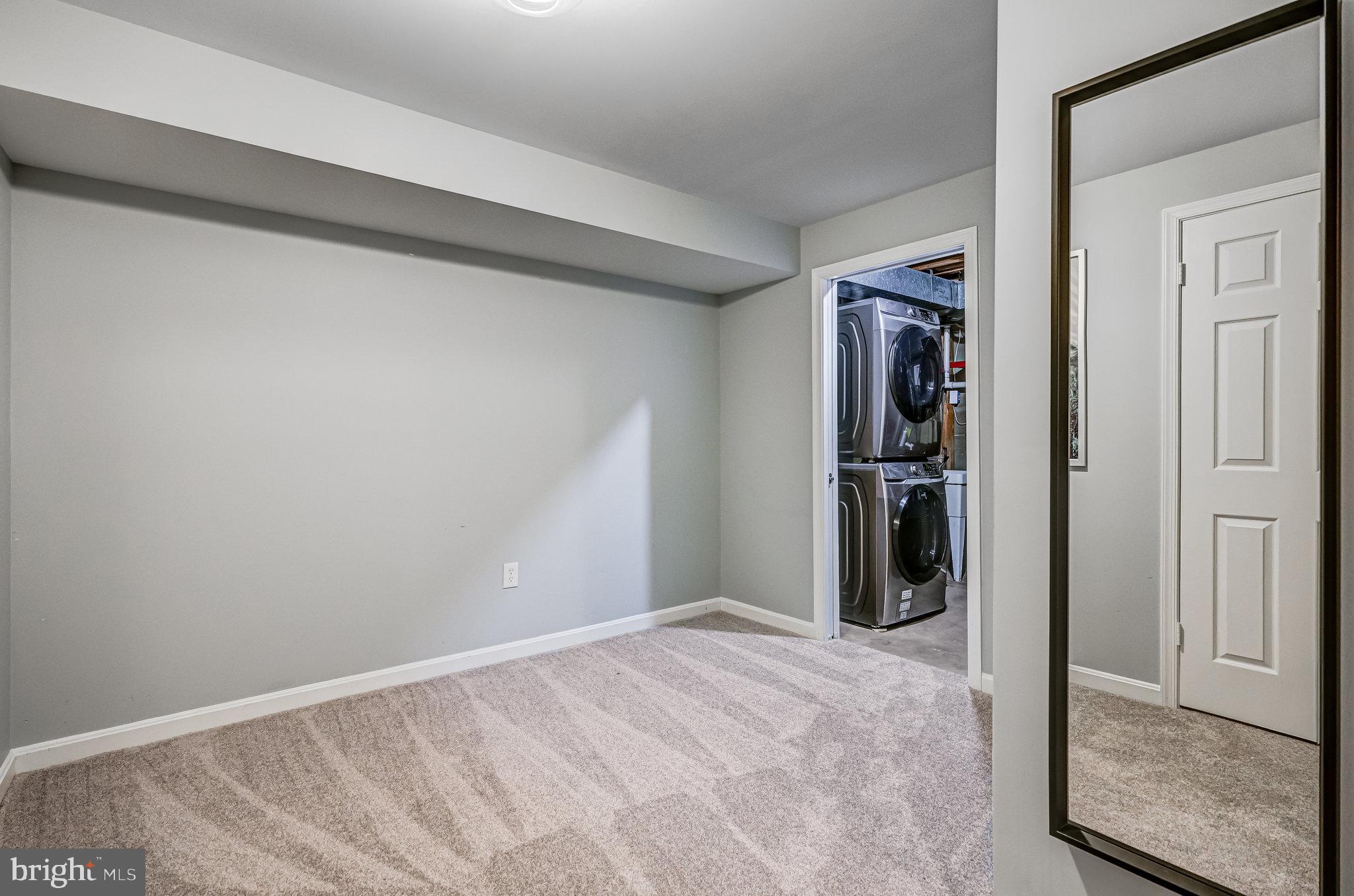 8046 Galla Knoll Circle Springfield, VA 22153 - Photo 29 of 38 a view of a hallway with wooden shelves