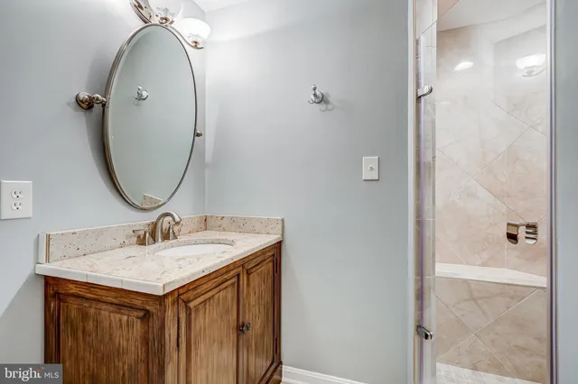 a view of a balcony with chairs and wooden floor