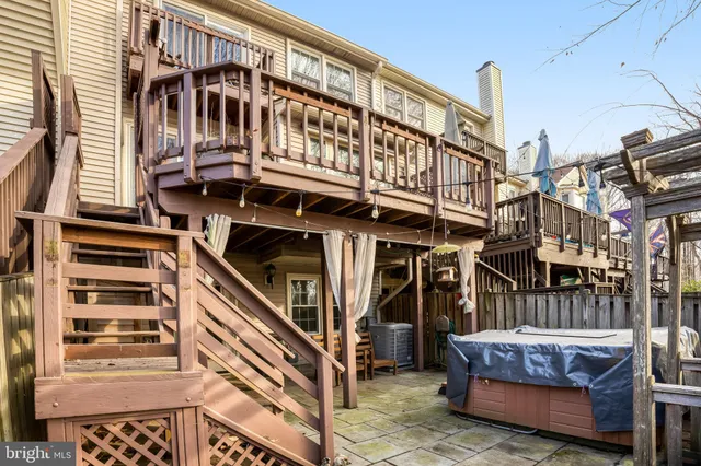 a view of a wooden deck with a yard