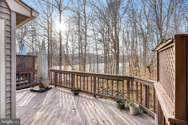 a view of a house with wooden fence
