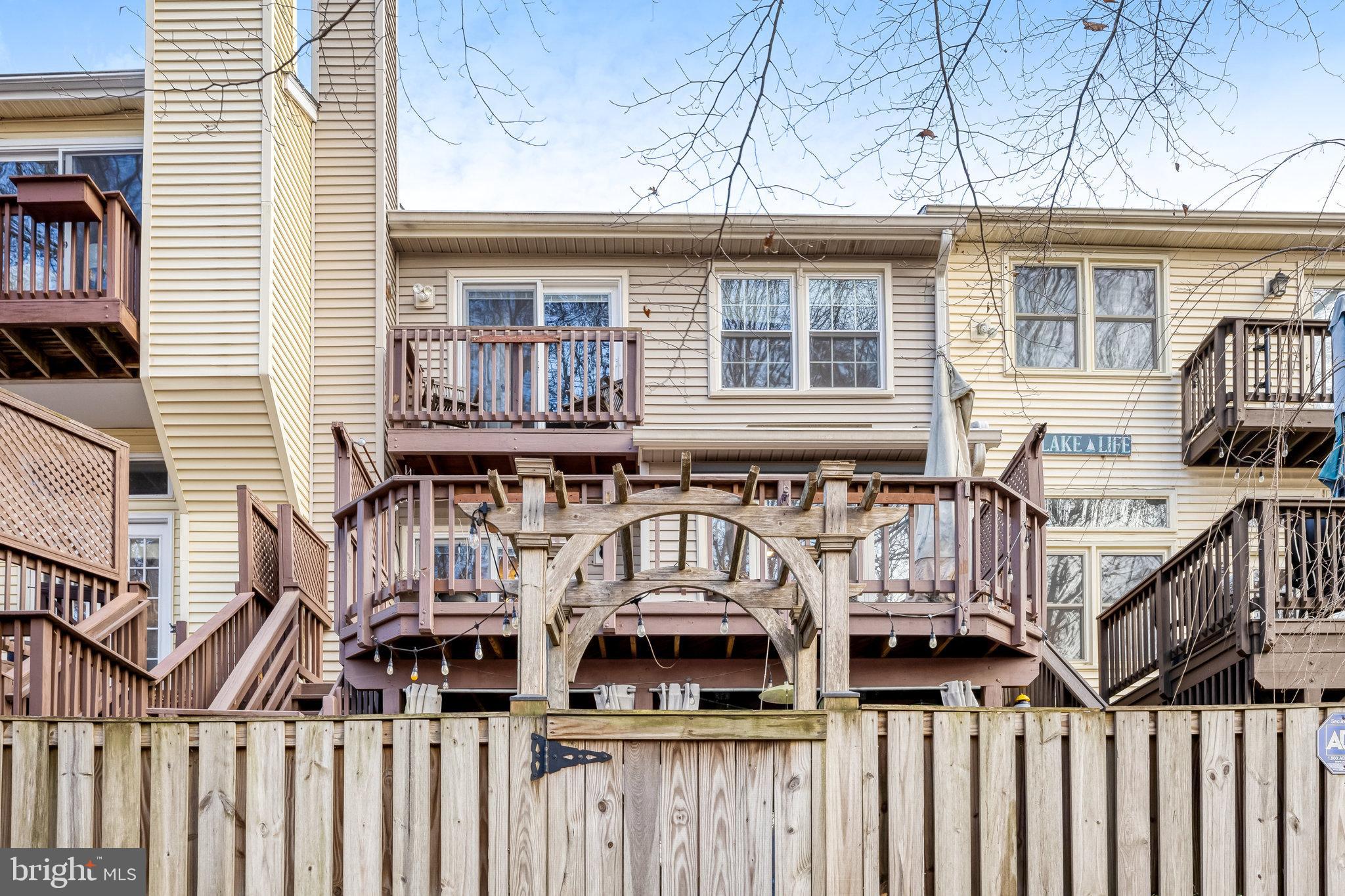 8046 Galla Knoll Circle Springfield, VA 22153 - Photo 36 of 38 a view of a house with wooden fence