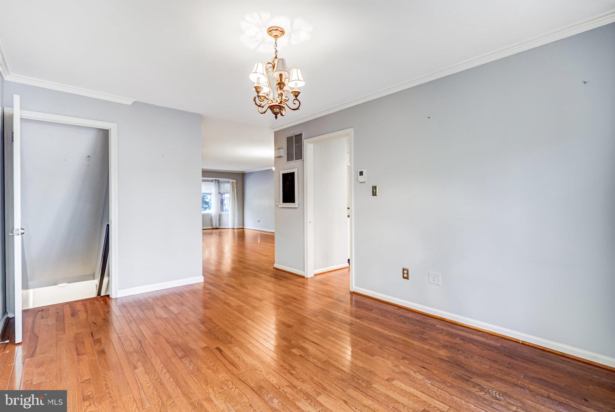 8046 Galla Knoll Circle Springfield, VA 22153 - Photo 7 of 38 a view of an empty room with wooden floor