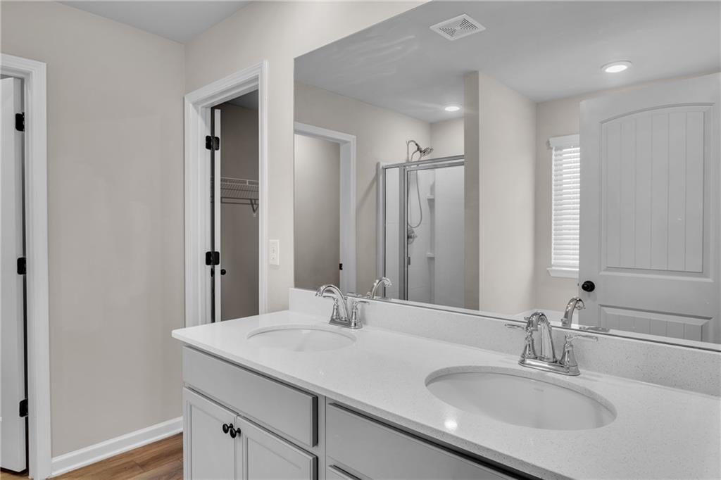 11608 Winston Way Hampton, GA 30228 - Photo 11 of 16 a bathroom with a sink and a mirror