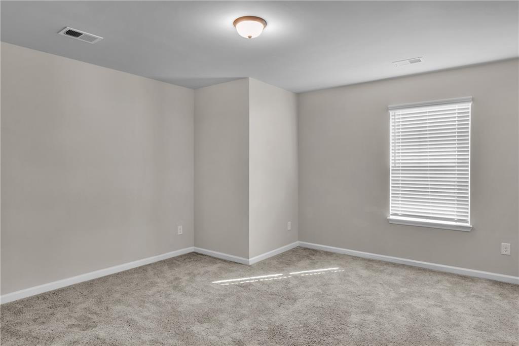 11608 Winston Way Hampton, GA 30228 - Photo 12 of 16 a view of an empty room with a window