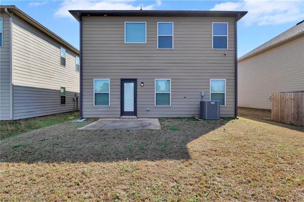 a view of a backyard of the house