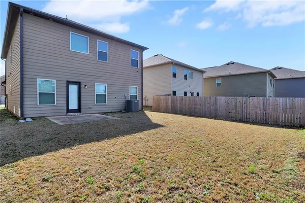 a view of a backyard of the house