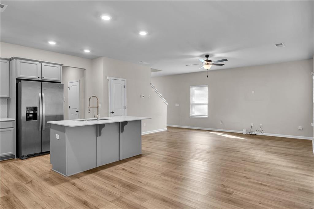 11608 Winston Way Hampton, GA 30228 - Photo 4 of 16 a view of kitchen with cabinets appliances and wooden floor