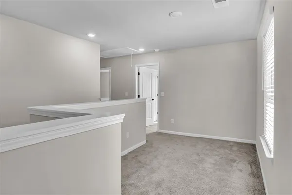 a bathroom with a sink a toilet and a large mirror