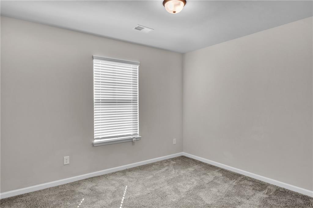 11608 Winston Way Hampton, GA 30228 - Photo 8 of 16 an empty room with a window