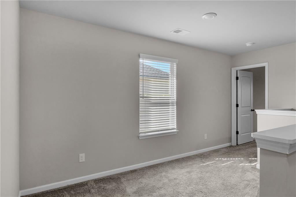 11608 Winston Way Hampton, GA 30228 - Photo 9 of 16 an empty room with windows
