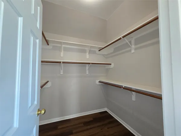 a view of an empty walk in closet