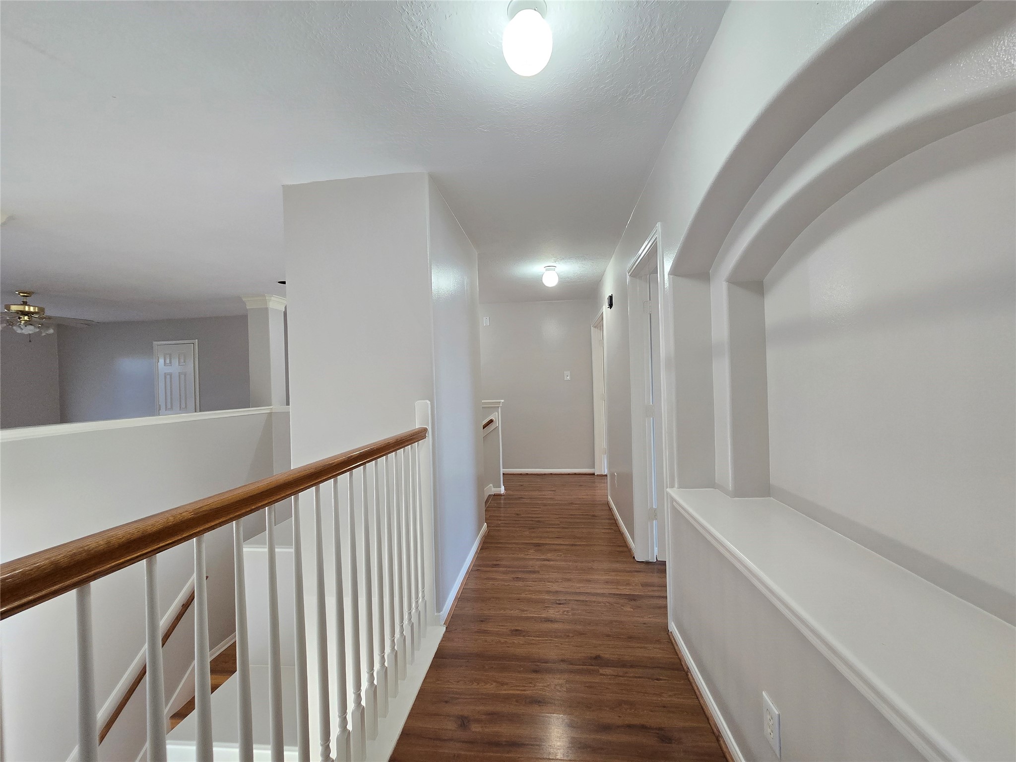 18819 Harbor Key Circle Houston, TX 77084 - Photo 28 of 33 a view of a hallway with wooden floor