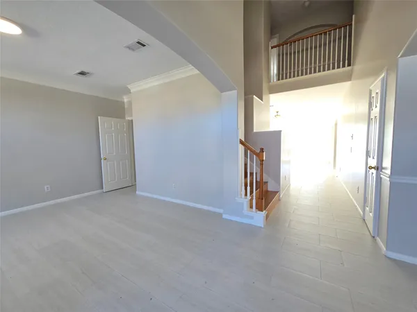 a view of a hallway with staircase