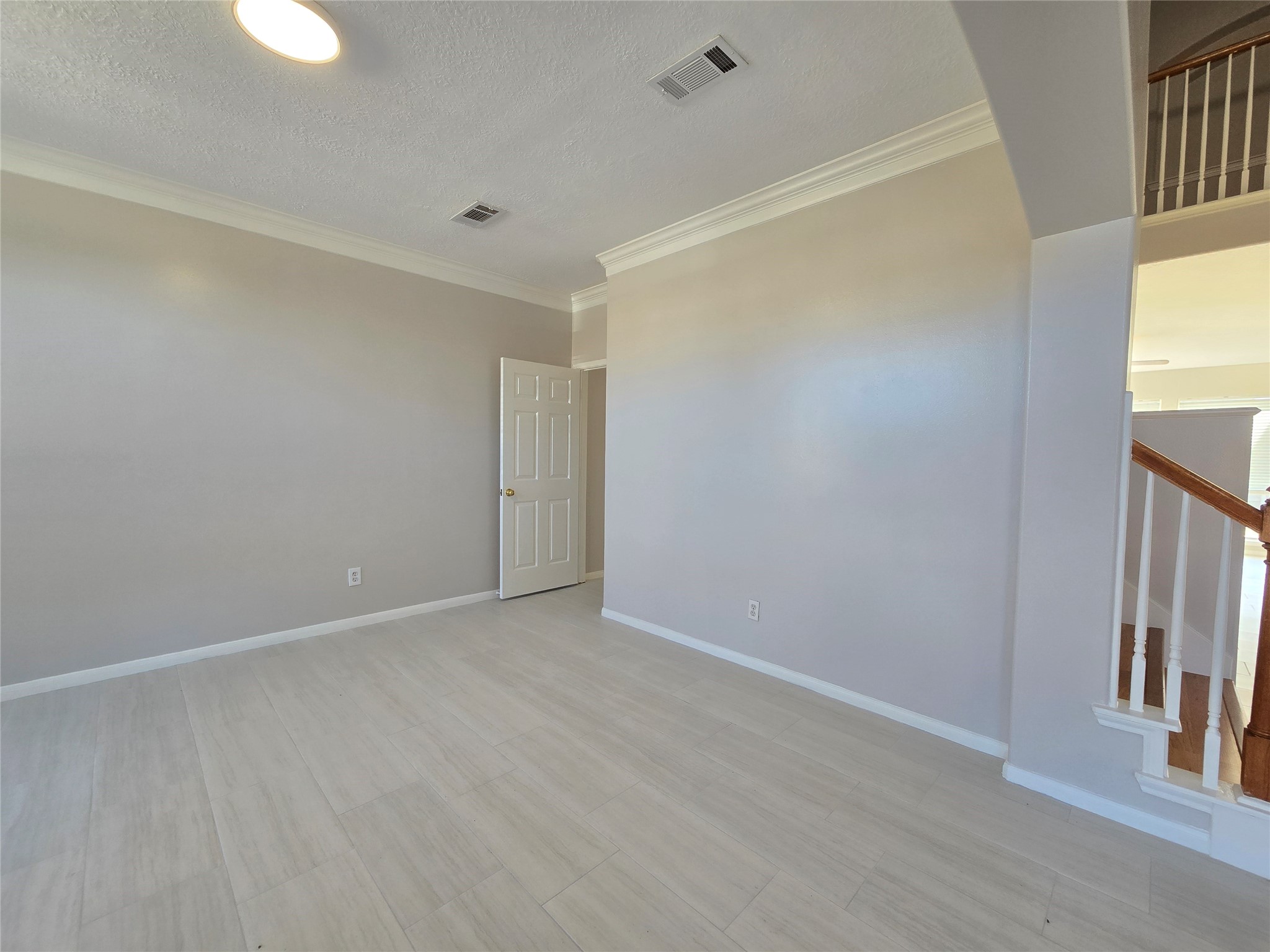 18819 Harbor Key Circle Houston, TX 77084 - Photo 5 of 33 wooden floor in an empty room with a window