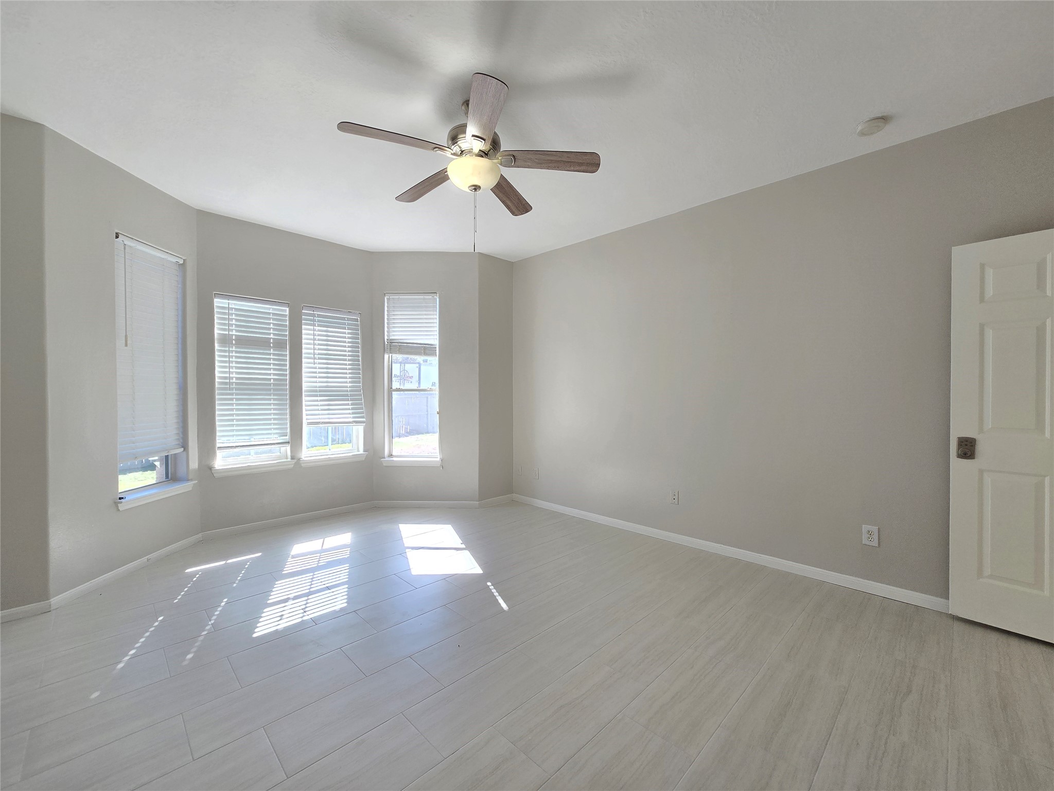18819 Harbor Key Circle Houston, TX 77084 - Photo 9 of 33 a view of an empty room with chandelier fan and fire place