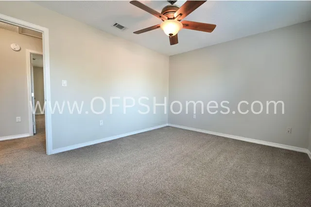 a view of a yard with large trees