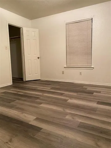 a view of a livingroom with wooden floor