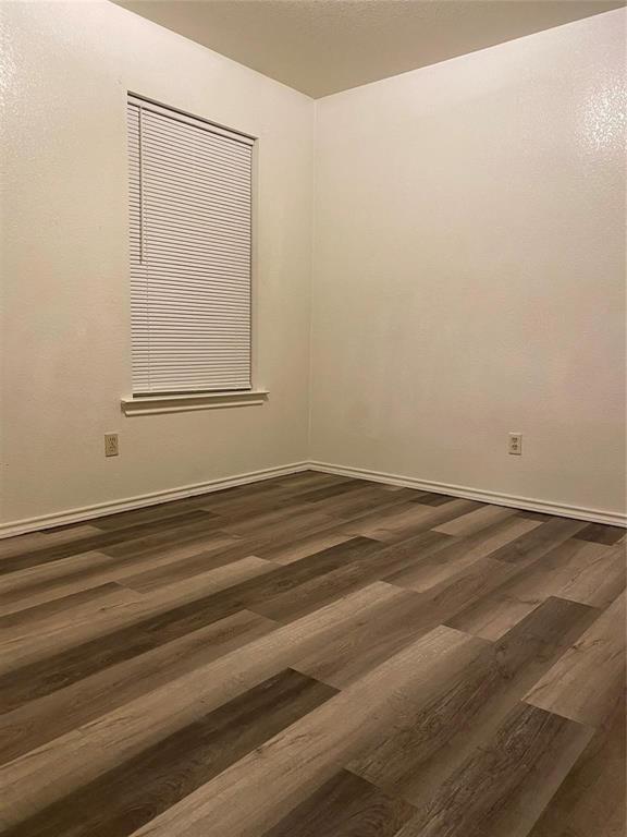 1518 Cherry Street Gainesville, TX 76240 - Photo 5 of 5 a view of a room with wooden floor and cabinet