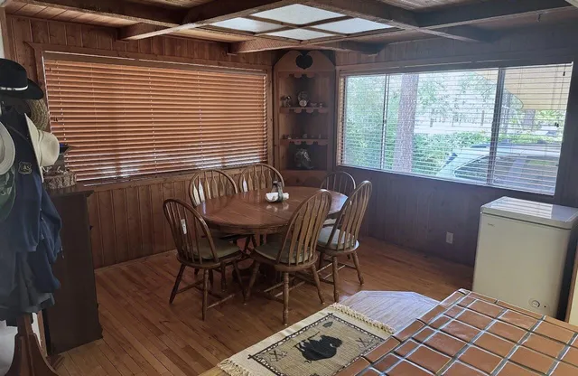 a dining room with furniture and window