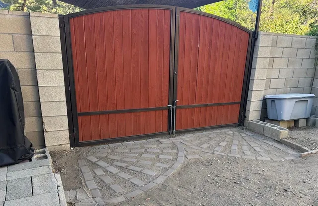 a view of a backyard with wooden fence