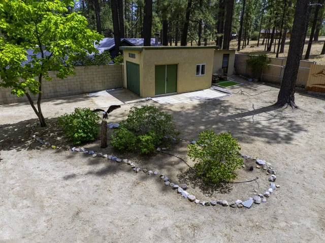a backyard of a house with outdoor seating