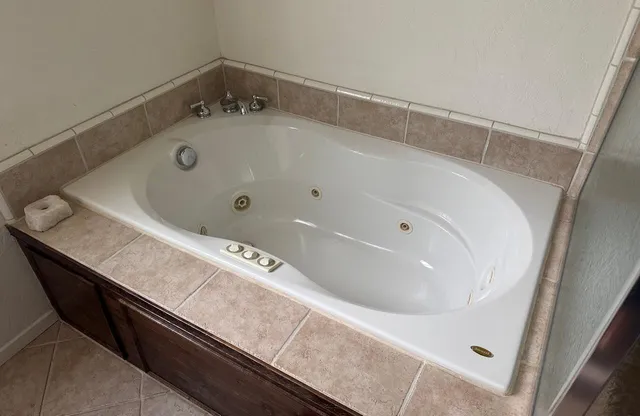 a bath tub sitting in a bathroom