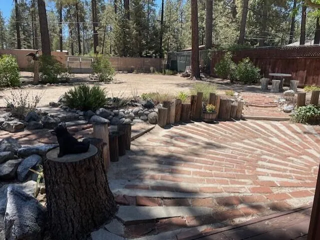 a view of a backyard with sitting area