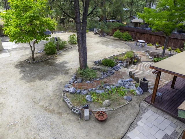 a wooden bench sitting in backside of a house