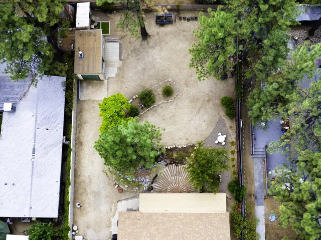 an aerial view of residential houses with outdoor space