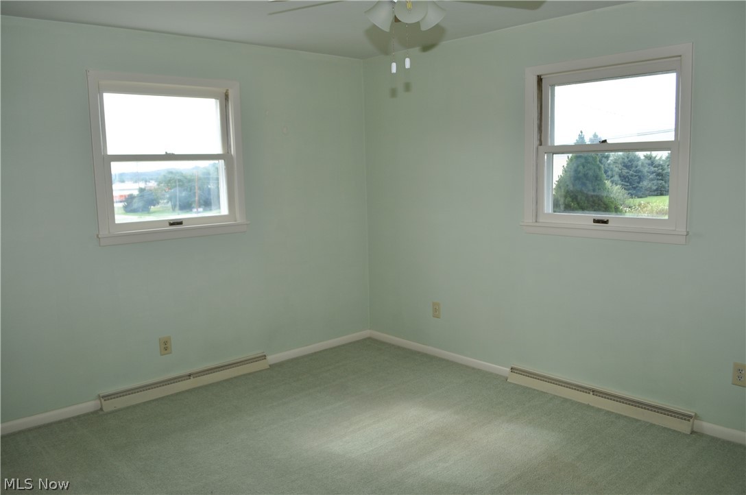 8262 Navarre Road Southwest Massillon, OH 44646 - Photo 17 of 26 master bedroom with ceiling fan